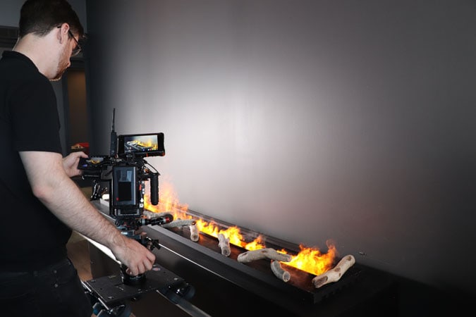 https://www.candyboxmarketing.com/wp-content/uploads/2021/11/BTS-Filming-Flames-at-Custom-Fireplace-Design.jpg