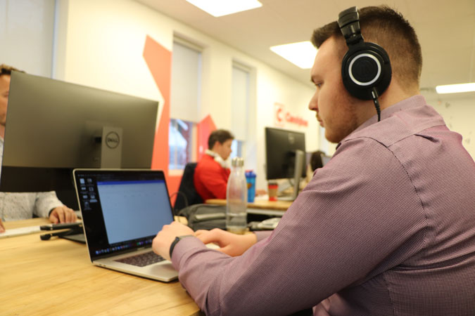 https://www.candyboxmarketing.com/wp-content/uploads/2021/11/Michael-Working-at-Desk-in-Dress-Shirt.jpg